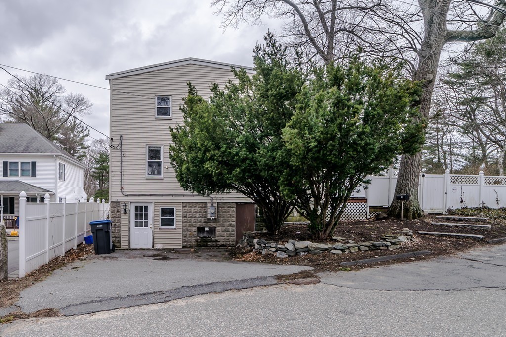 14 Magnolia Road Natick, MA 01760 - Photo 11 of 11 a front view of a house with a tree in it