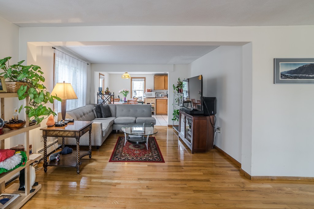 14 Magnolia Road Natick, MA 01760 - Photo 3 of 11 a living room with furniture and a wooden floor