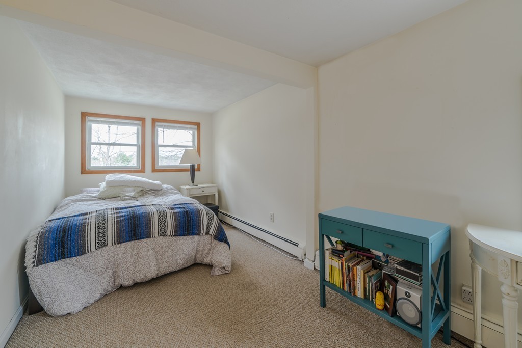 14 Magnolia Road Natick, MA 01760 - Photo 7 of 11 a living room with a bed and a window