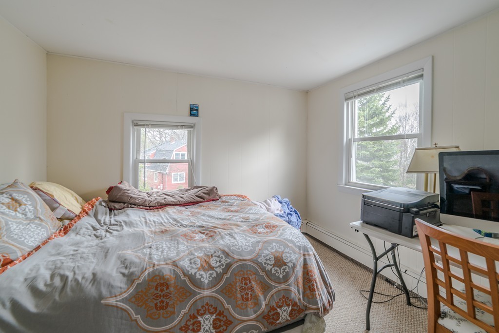 14 Magnolia Road Natick, MA 01760 - Photo 8 of 11 a bedroom with a bed and a window