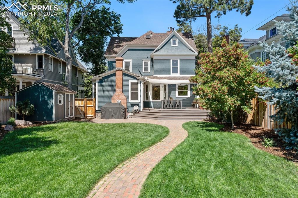1331 North Tejon Street Colorado Springs, CO 80903 - Photo 19 of 45 a front view of a house with a yard