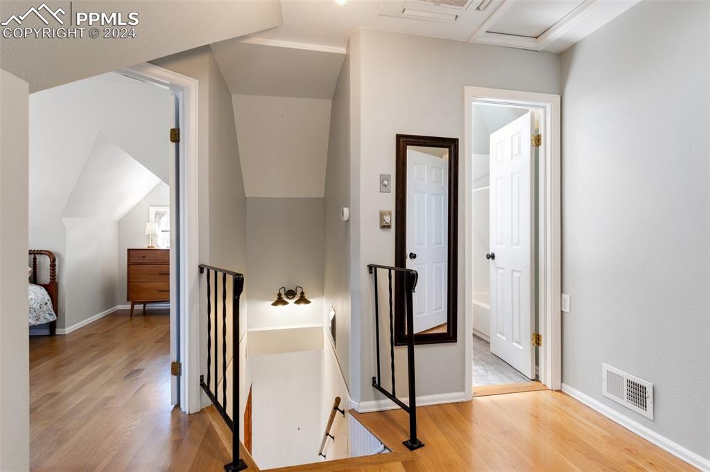 1331 North Tejon Street Colorado Springs, CO 80903 - Photo 34 of 45 a view of a hallway with wooden floor and workspace