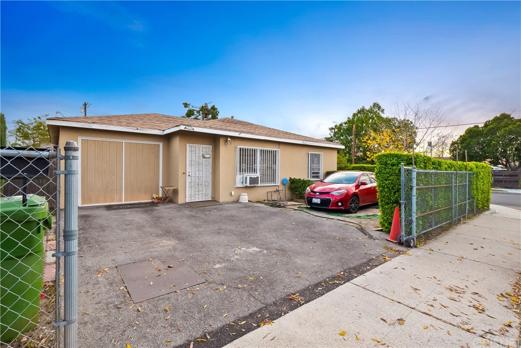 10716 Ralston Avenue Pacoima, CA 91331 - Photo 1 of 1 a view of a house with a yard and garage