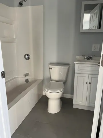 a bathroom with a toilet sink and bathtub