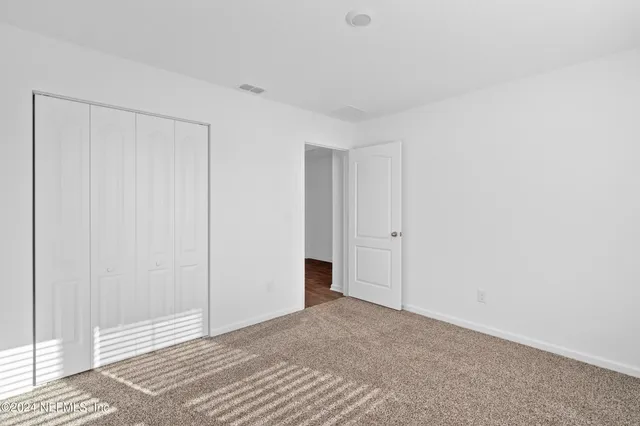 a view of a room with an empty space