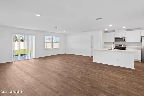 a view of a kitchen with a sink and a window