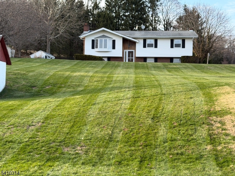 252 Mountain View Road West Asbury, NJ 08802 - Photo 1 of 28 a front view of a house with a yard