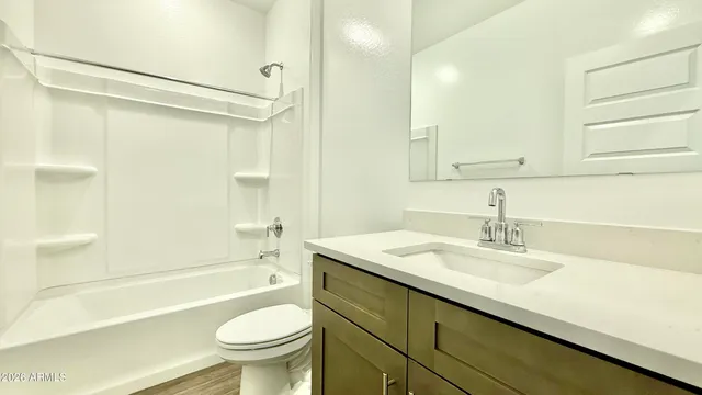 a bathroom with a sink a toilet and a bathtub