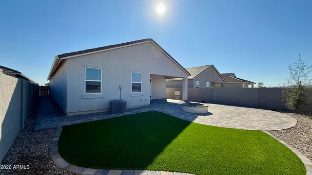 a front view of a house with a yard and porch