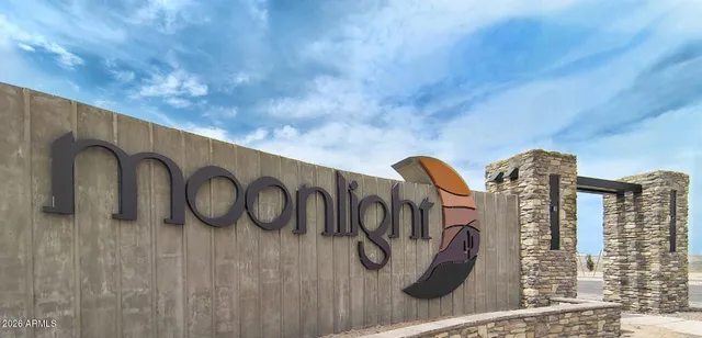 an aerial view of a house with a garden and lake view