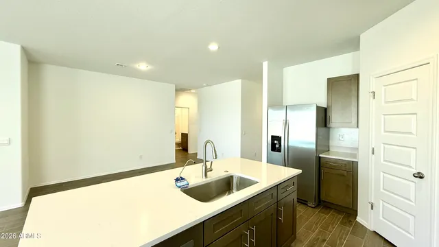 a bathroom with a sink and a large mirror