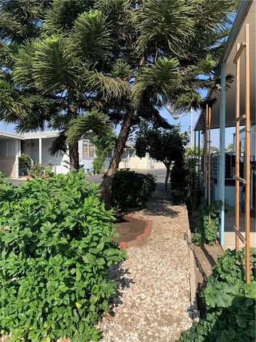 a view of path along with house and trees