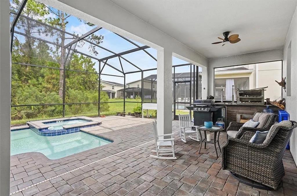 4585 Target Boulevard Kissimmee, FL 34746 - Photo 19 of 24 a living room with furniture and a floor to ceiling window