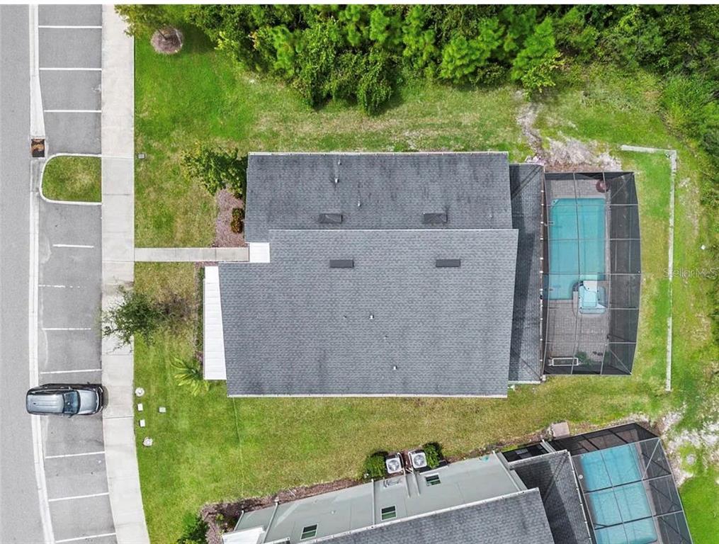 4585 Target Boulevard Kissimmee, FL 34746 - Photo 2 of 24 an aerial view of a house with a yard