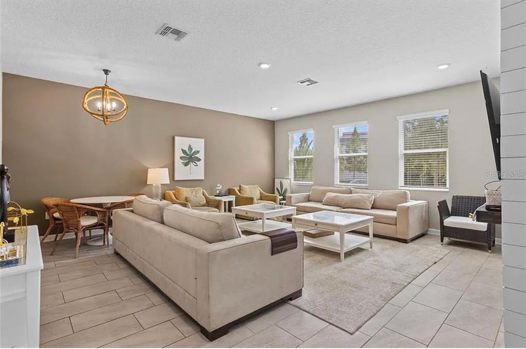 4585 Target Boulevard Kissimmee, FL 34746 - Photo 3 of 24 a living room with lots of furniture and a large window