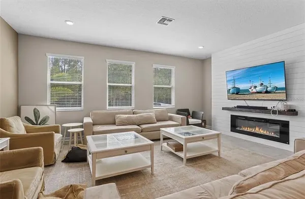 a living room with furniture and a fireplace