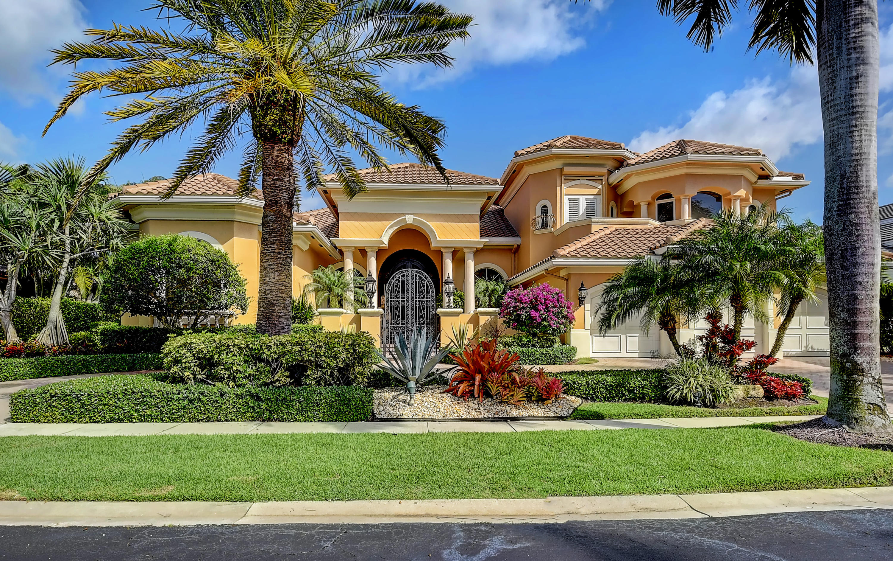 a front view of house with yard and green space
