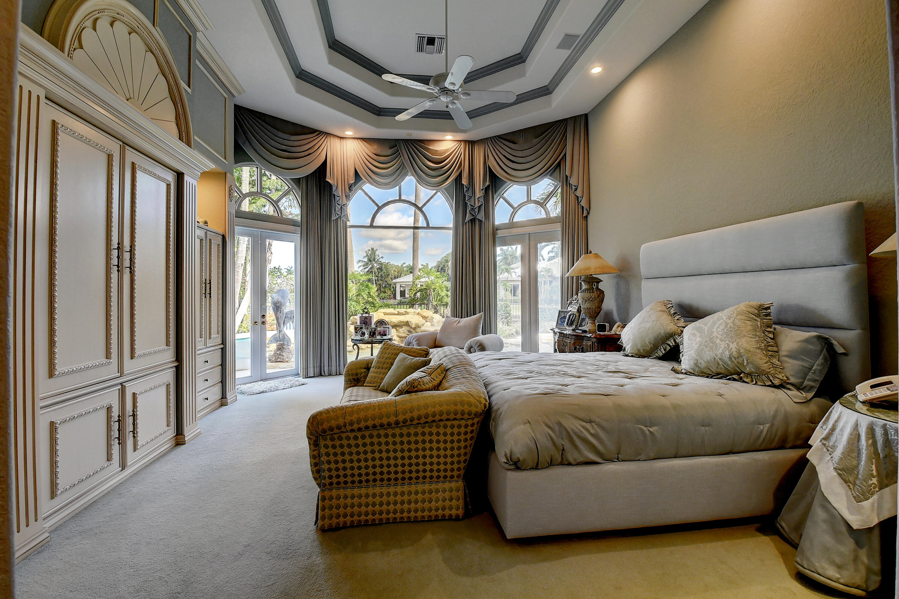 3811 Northwest Coventry Lane Boca Raton, FL 33496 - Photo 15 of 52 a bedroom with furniture and large windows