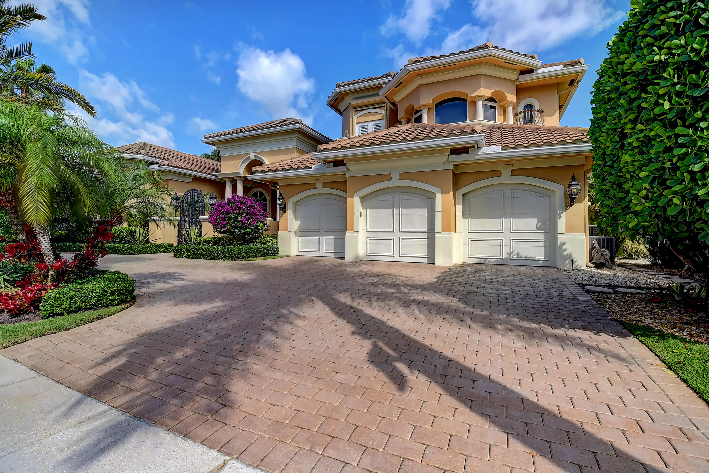 3811 Northwest Coventry Lane Boca Raton, FL 33496 - Photo 2 of 52 a front view of a house with a yard