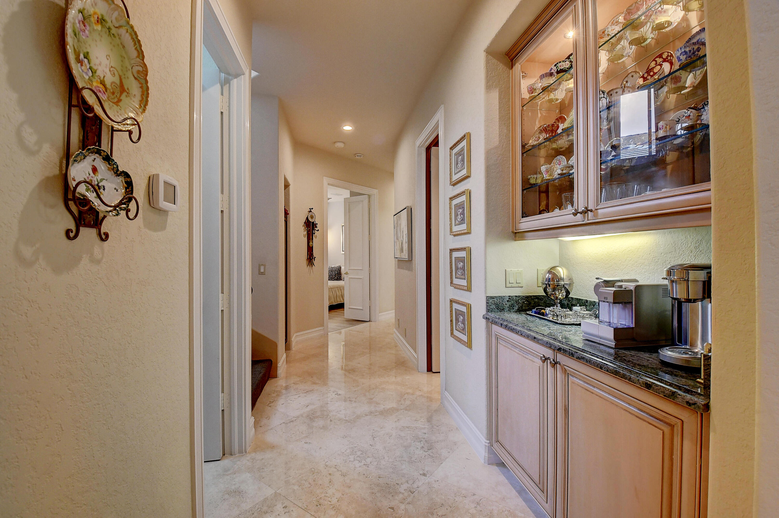 3811 Northwest Coventry Lane Boca Raton, FL 33496 - Photo 21 of 52 a kitchen with a refrigerator and a sink