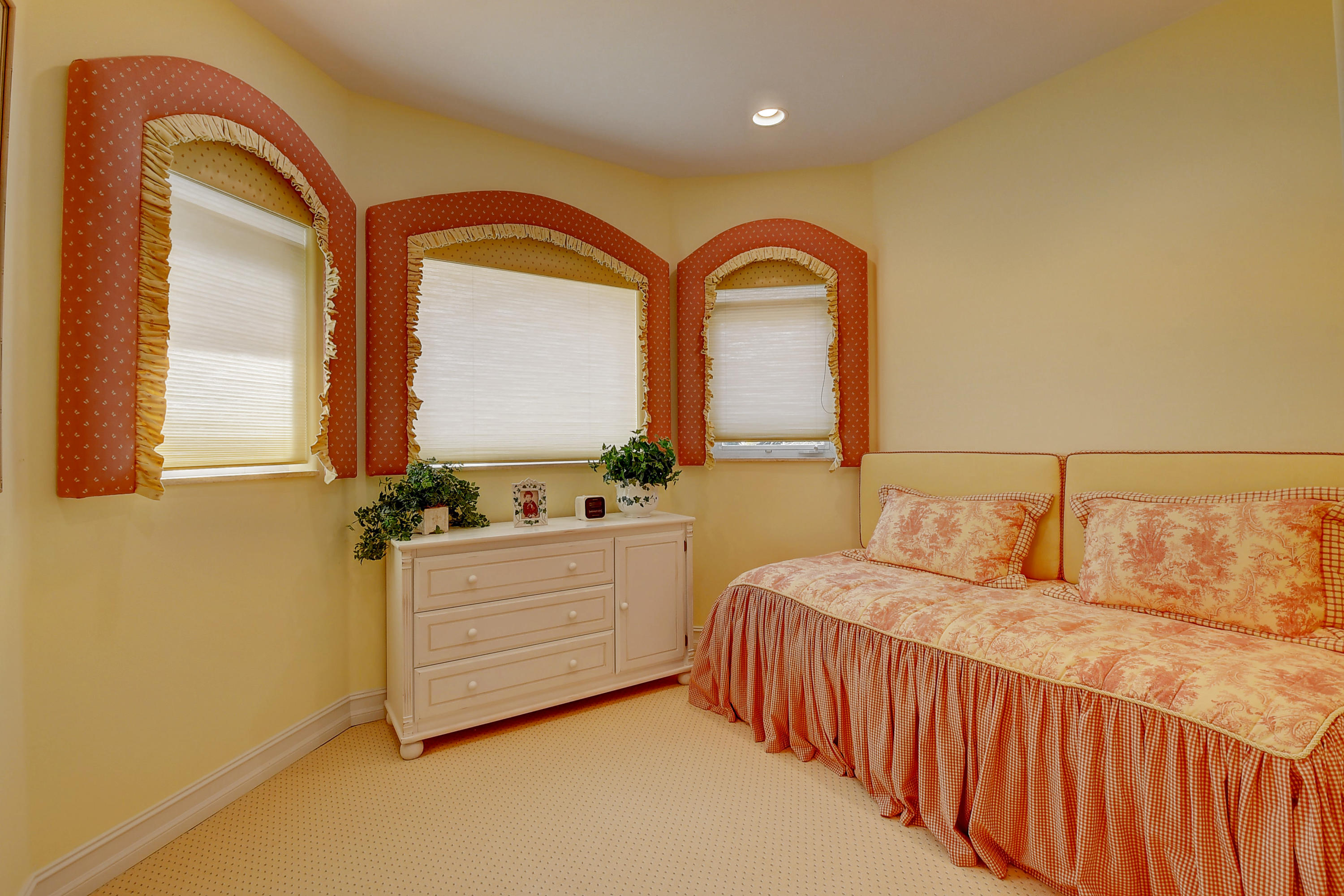 3811 Northwest Coventry Lane Boca Raton, FL 33496 - Photo 28 of 52 a bedroom with a bed and a dresser