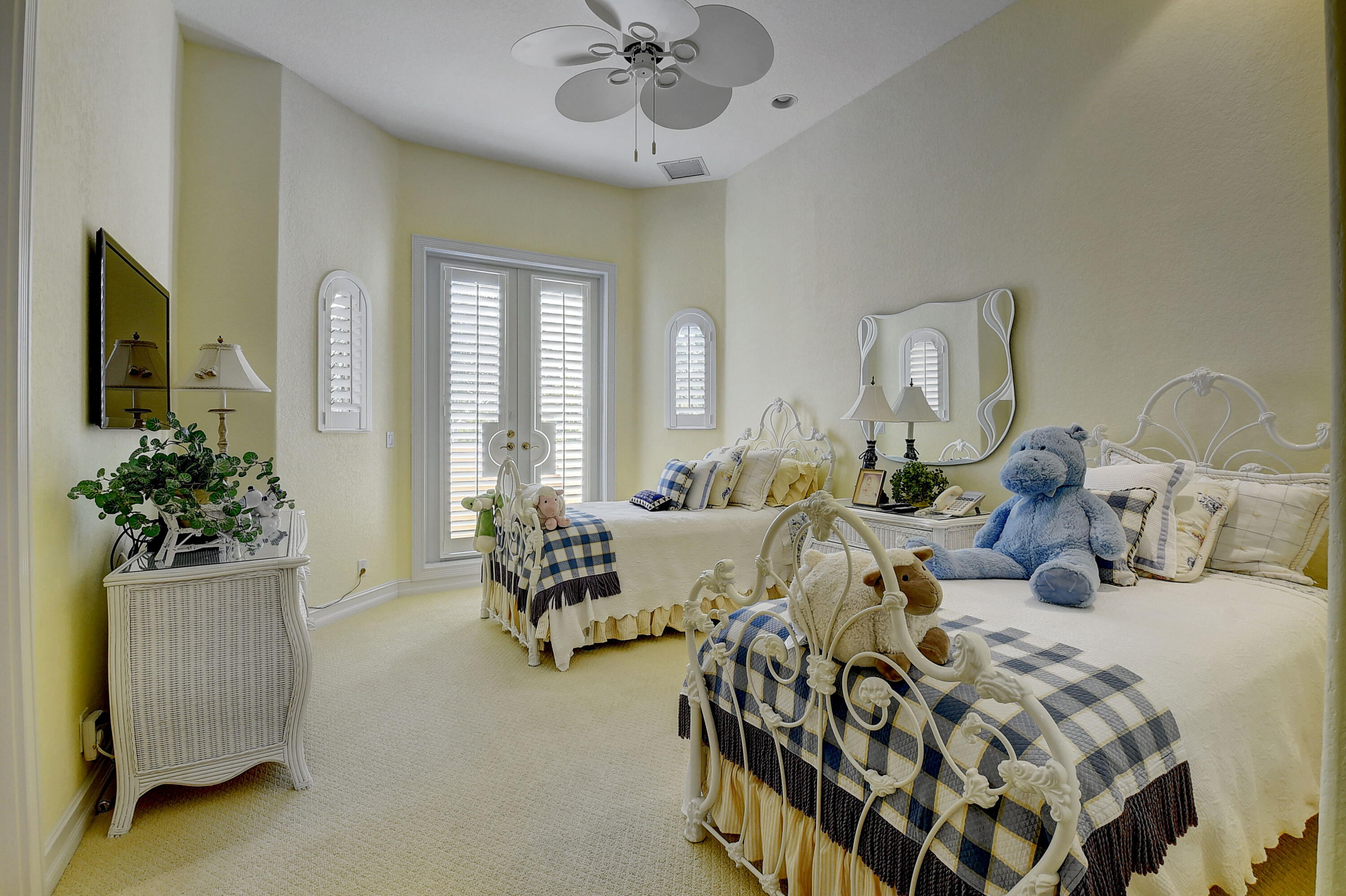 3811 Northwest Coventry Lane Boca Raton, FL 33496 - Photo 29 of 52 a bedroom with furniture and a large window