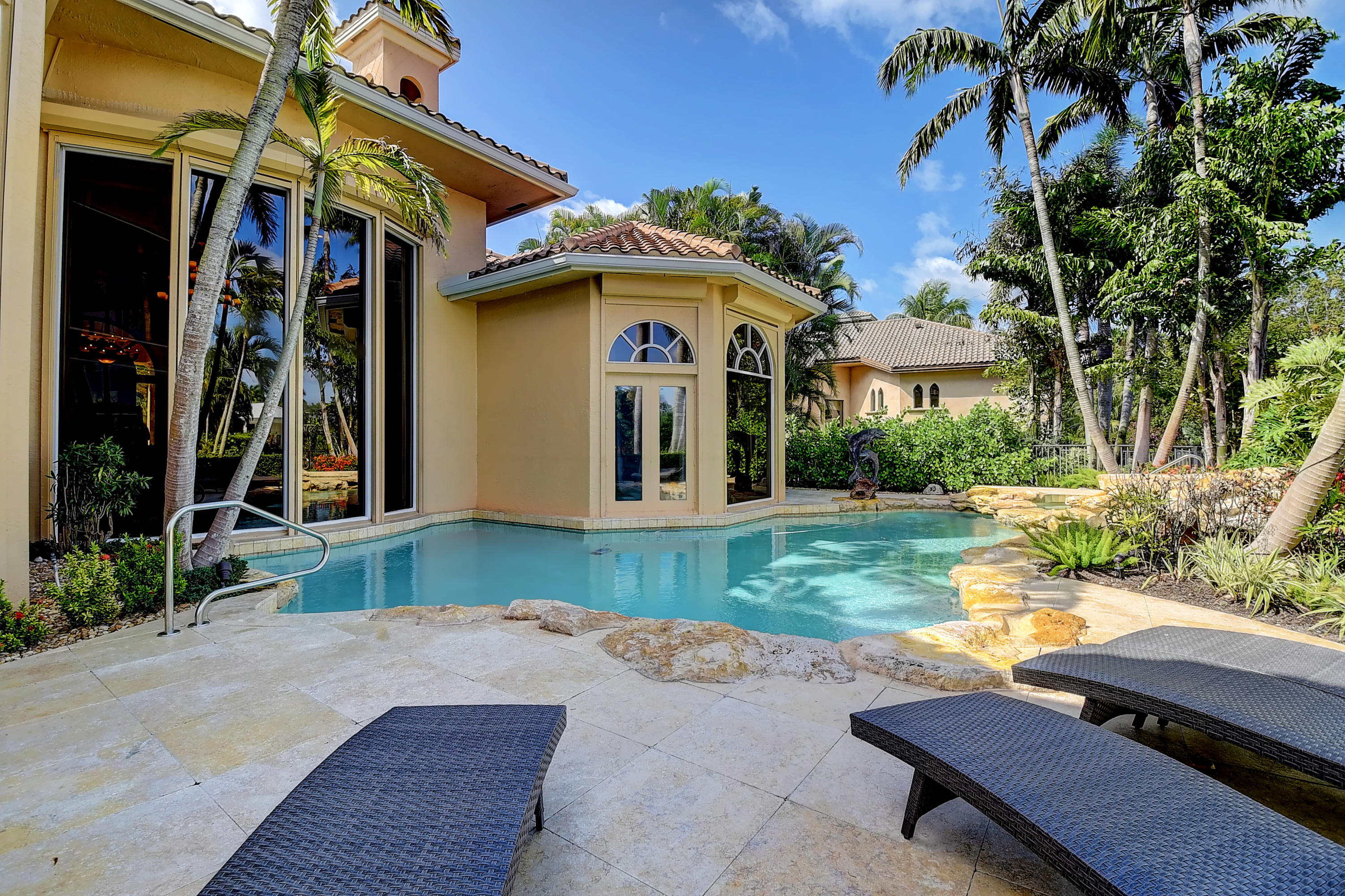 3811 Northwest Coventry Lane Boca Raton, FL 33496 - Photo 36 of 52 a front view of a house with garden