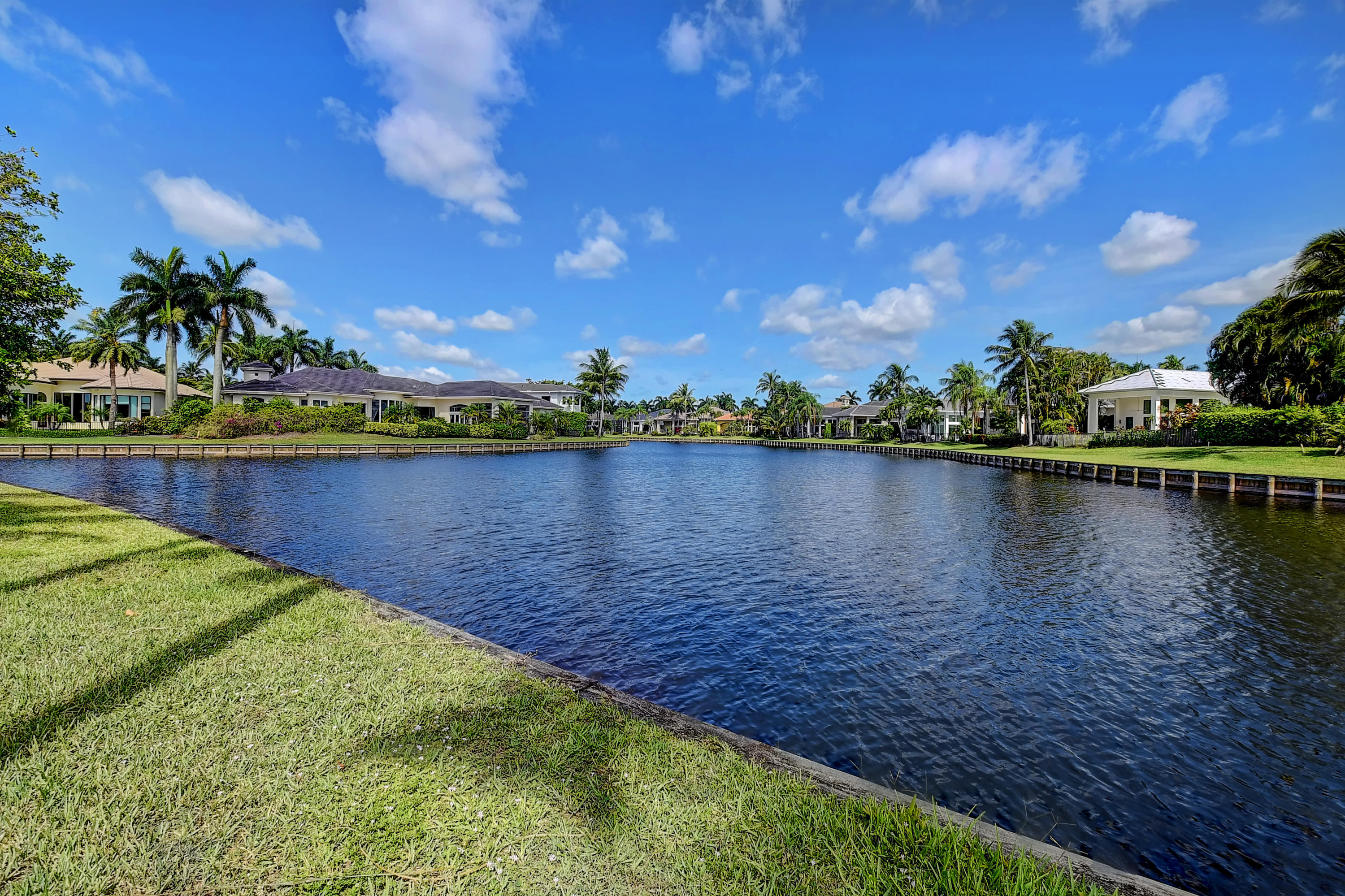 3811 Northwest Coventry Lane Boca Raton, FL 33496 - Photo 41 of 52 a view of a lake with houses in the back