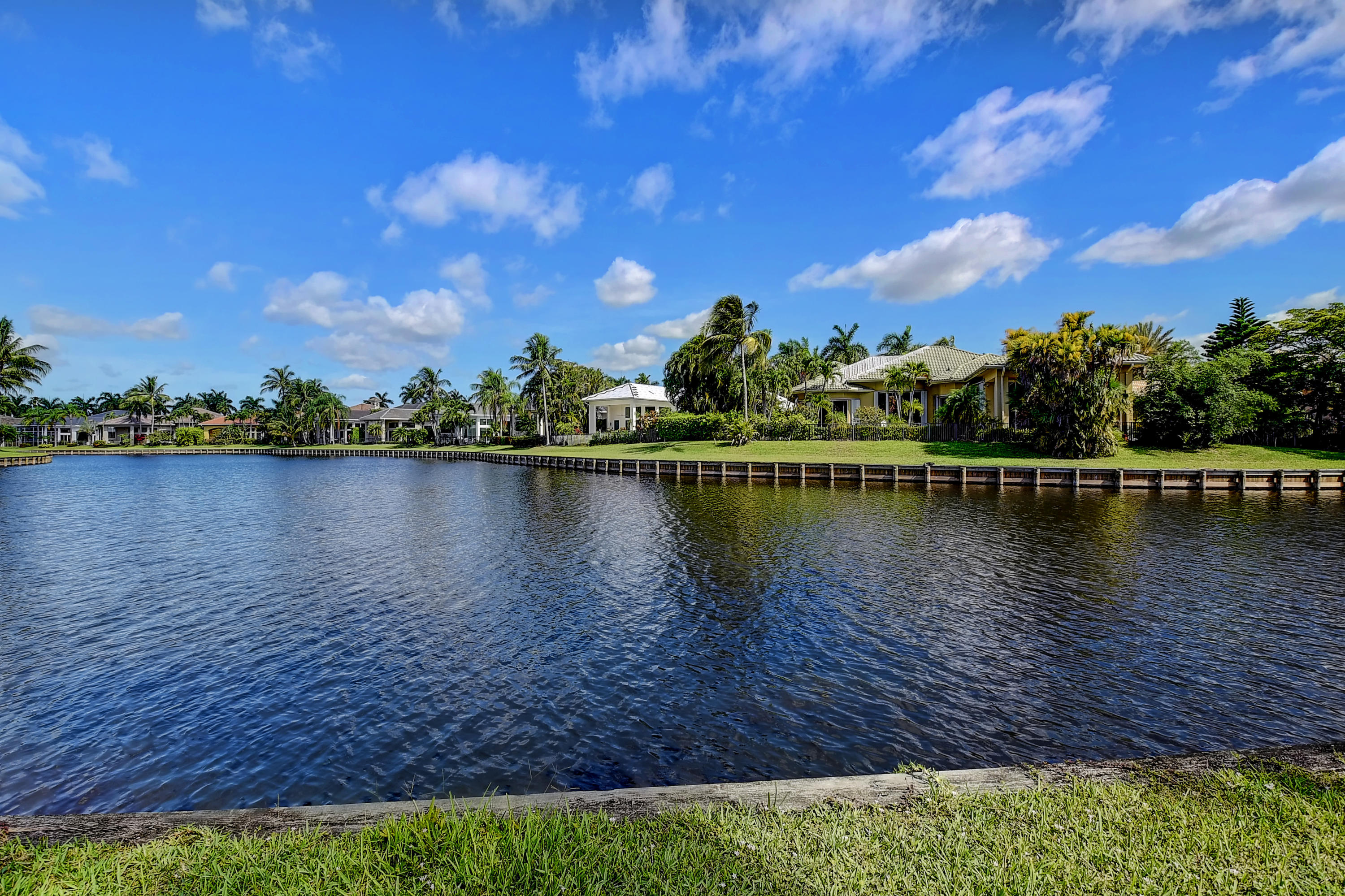 3811 Northwest Coventry Lane Boca Raton, FL 33496 - Photo 42 of 52 a view of a lake with houses in the back
