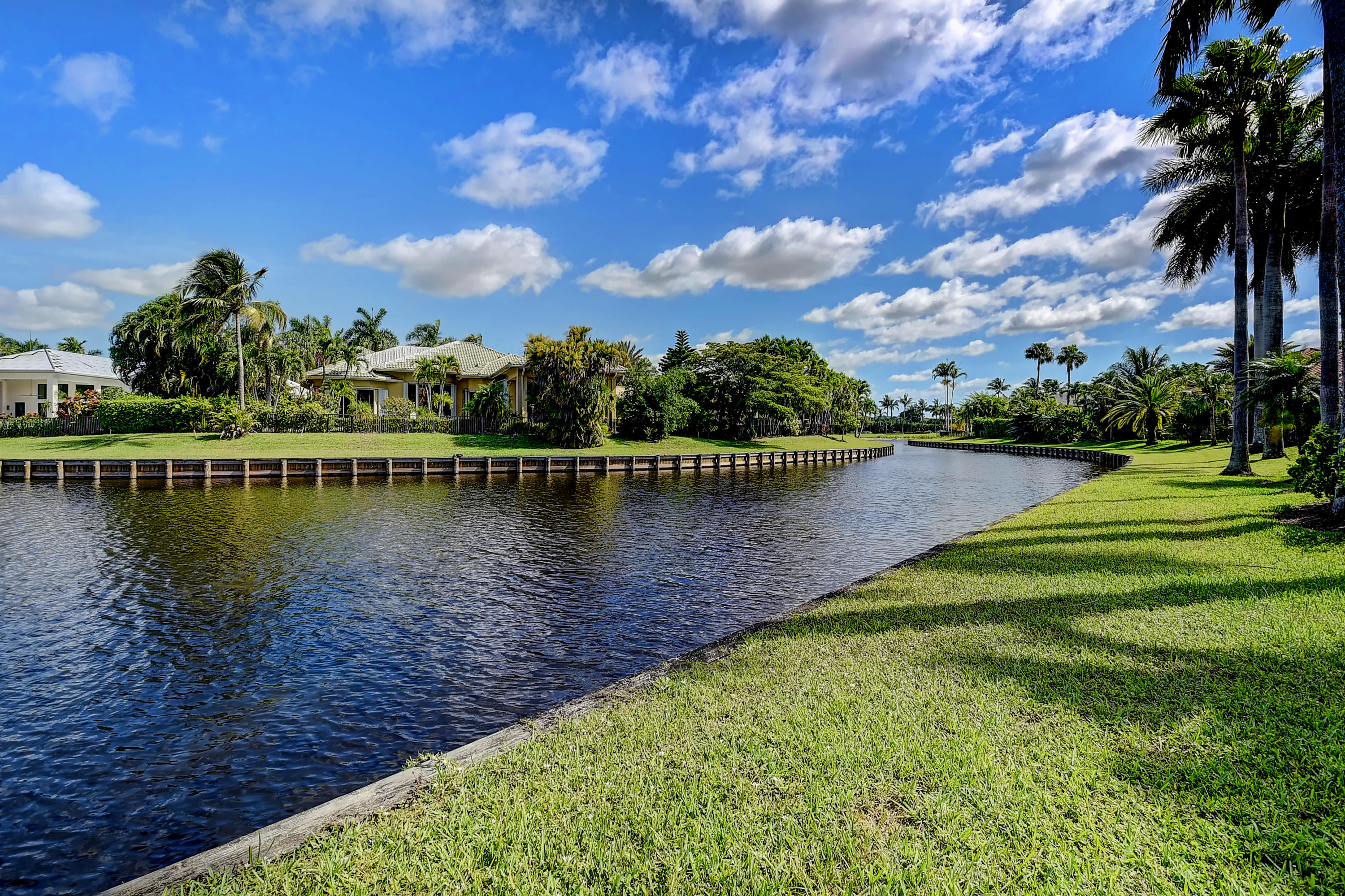 3811 Northwest Coventry Lane Boca Raton, FL 33496 - Photo 43 of 52 a view of a lake with houses in the back