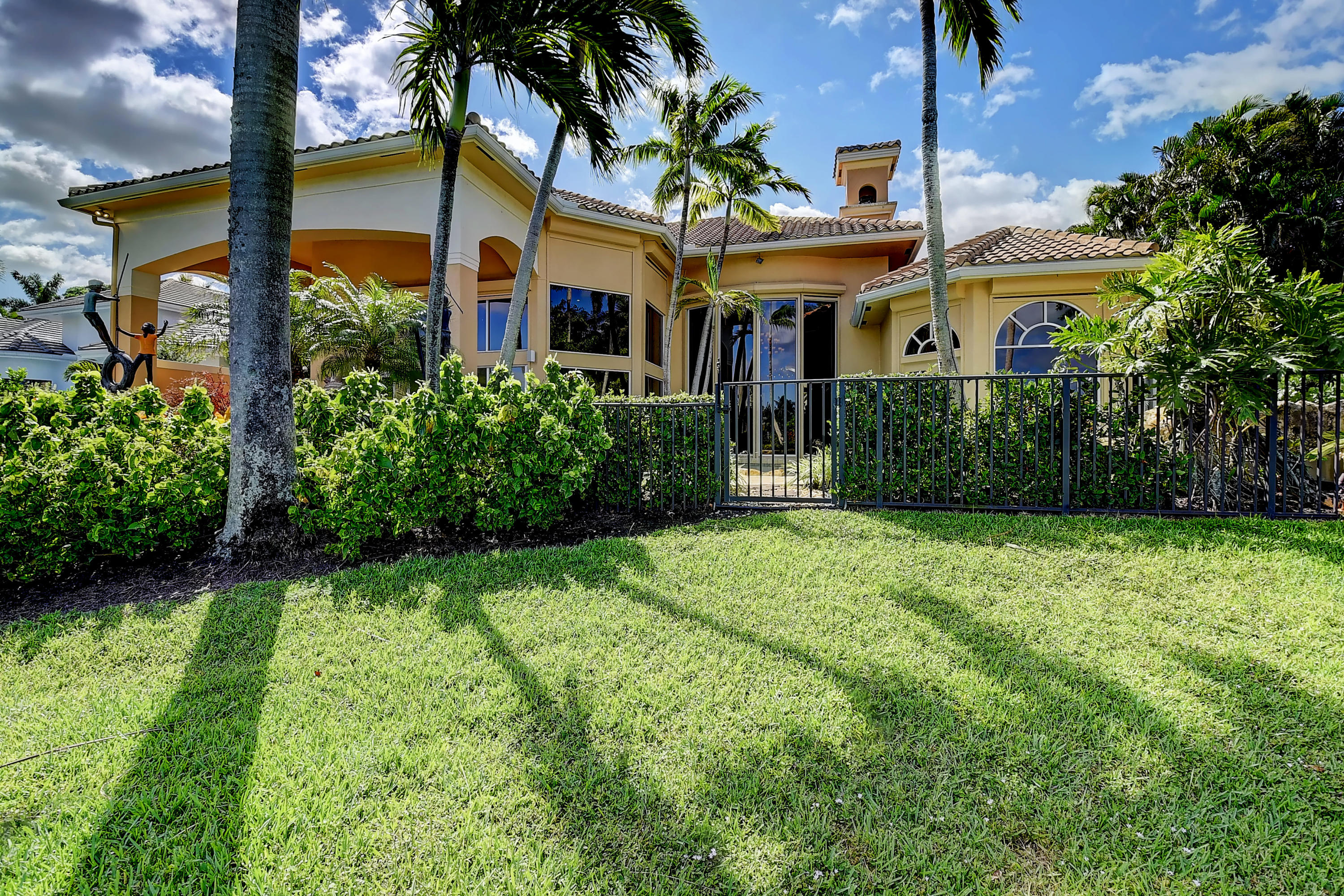 3811 Northwest Coventry Lane Boca Raton, FL 33496 - Photo 44 of 52 a front view of a house with garden