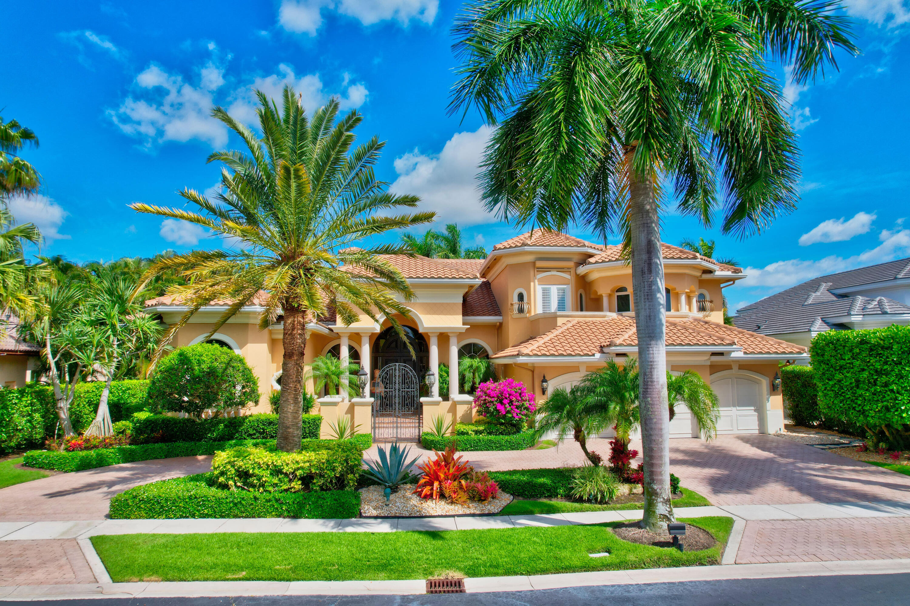 3811 Northwest Coventry Lane Boca Raton, FL 33496 - Photo 48 of 52 a front view of multi story residential apartment building with yard and green space