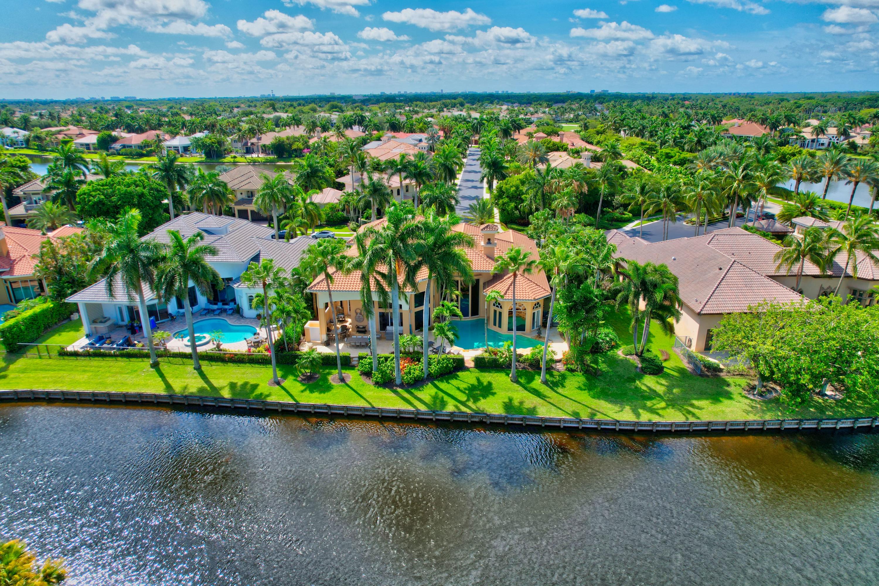 3811 Northwest Coventry Lane Boca Raton, FL 33496 - Photo 51 of 52 an aerial view of a house with a yard and lake view