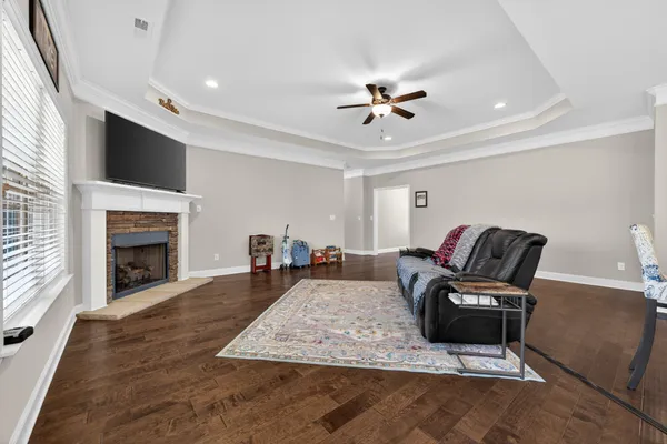 a living room with furniture fireplace and flat screen tv