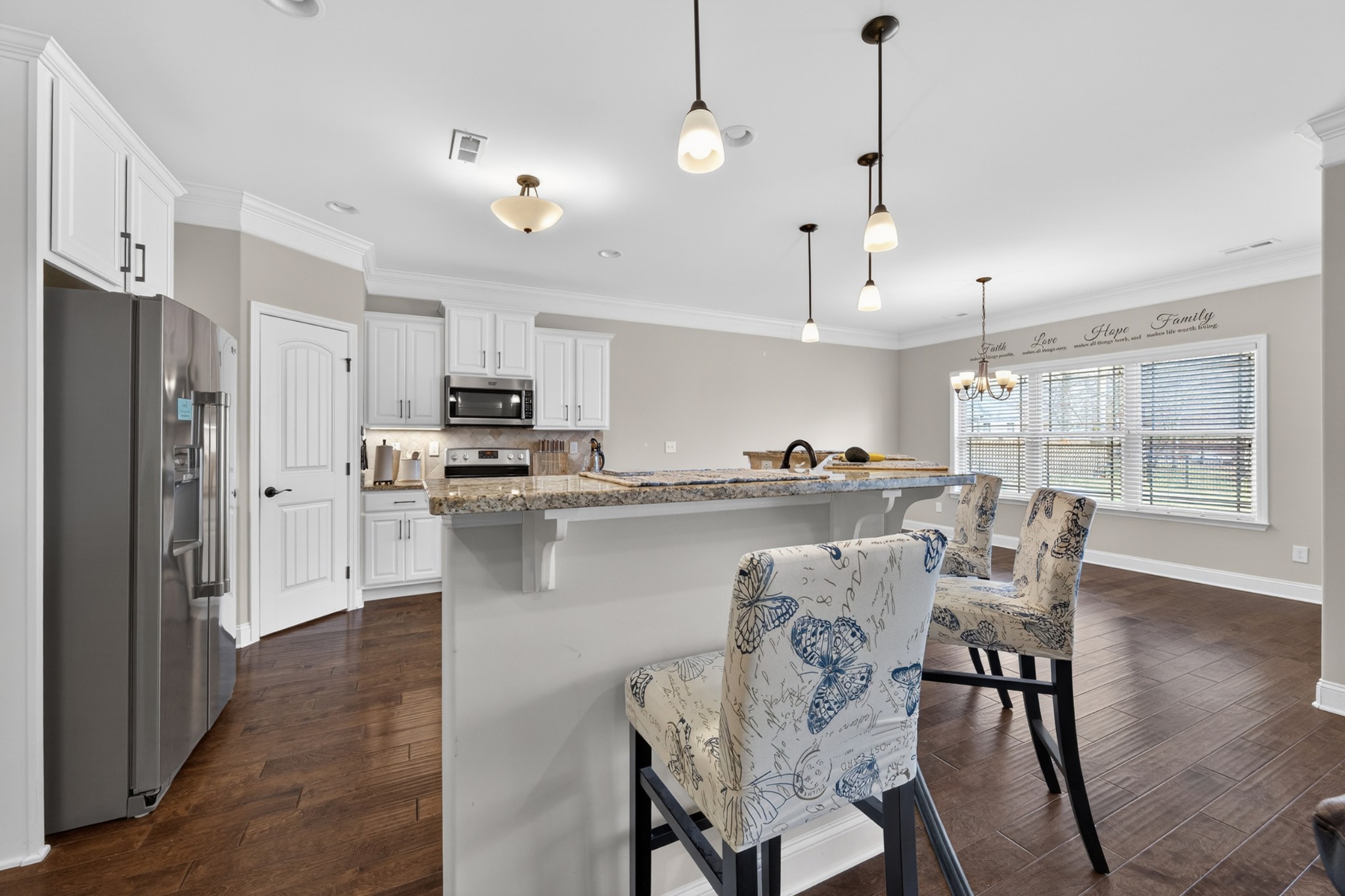25 Knotting Hill Road Fayetteville, TN 37334 - Photo 15 of 49 a kitchen with stainless steel appliances granite countertop a dining table chairs refrigerator and sink