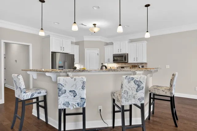a view of kitchen with microwave and cabinets