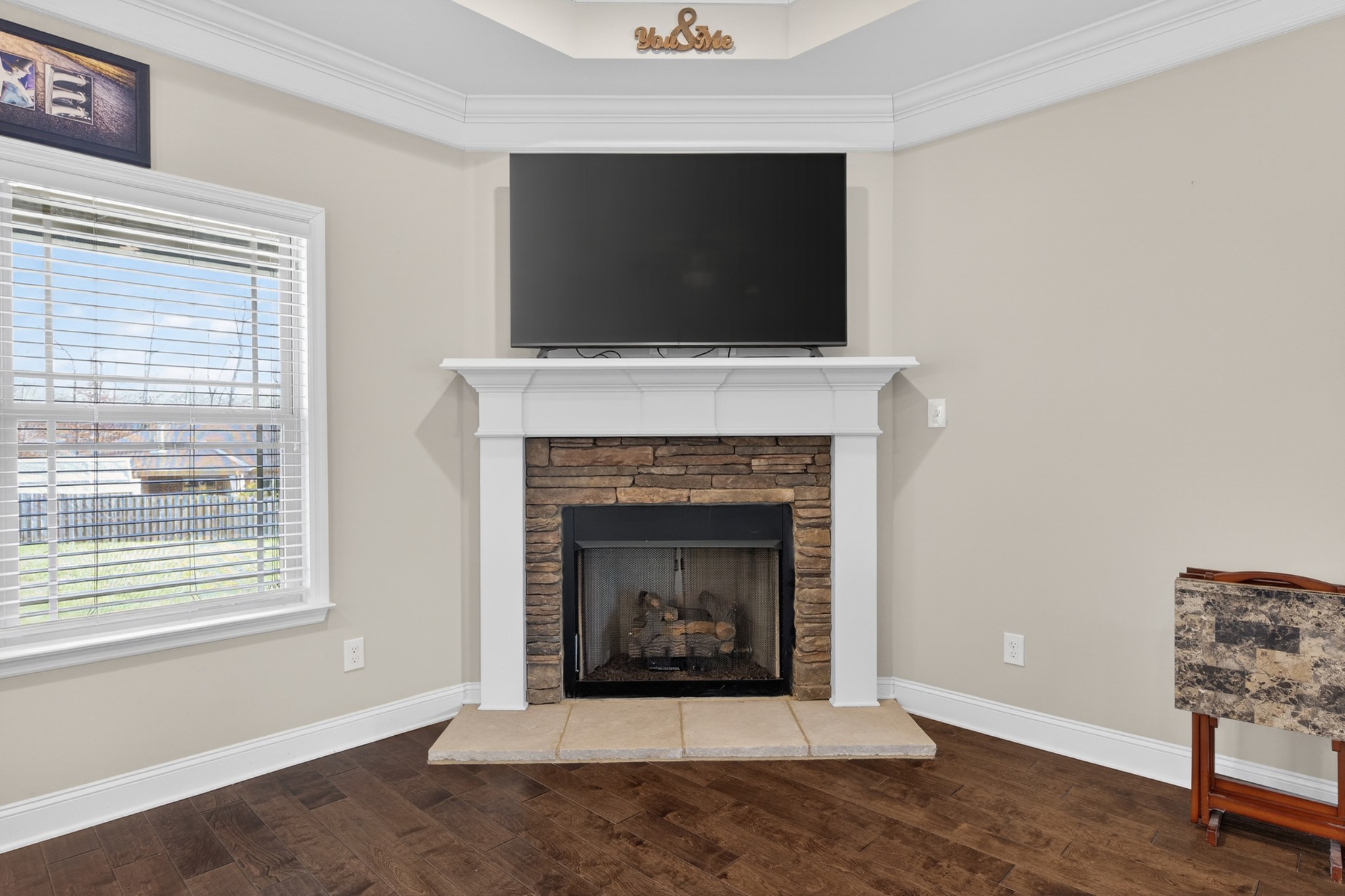 25 Knotting Hill Road Fayetteville, TN 37334 - Photo 22 of 49 a living room with a fireplace and a flat screen tv
