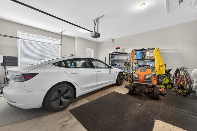 a view of a garage with cars