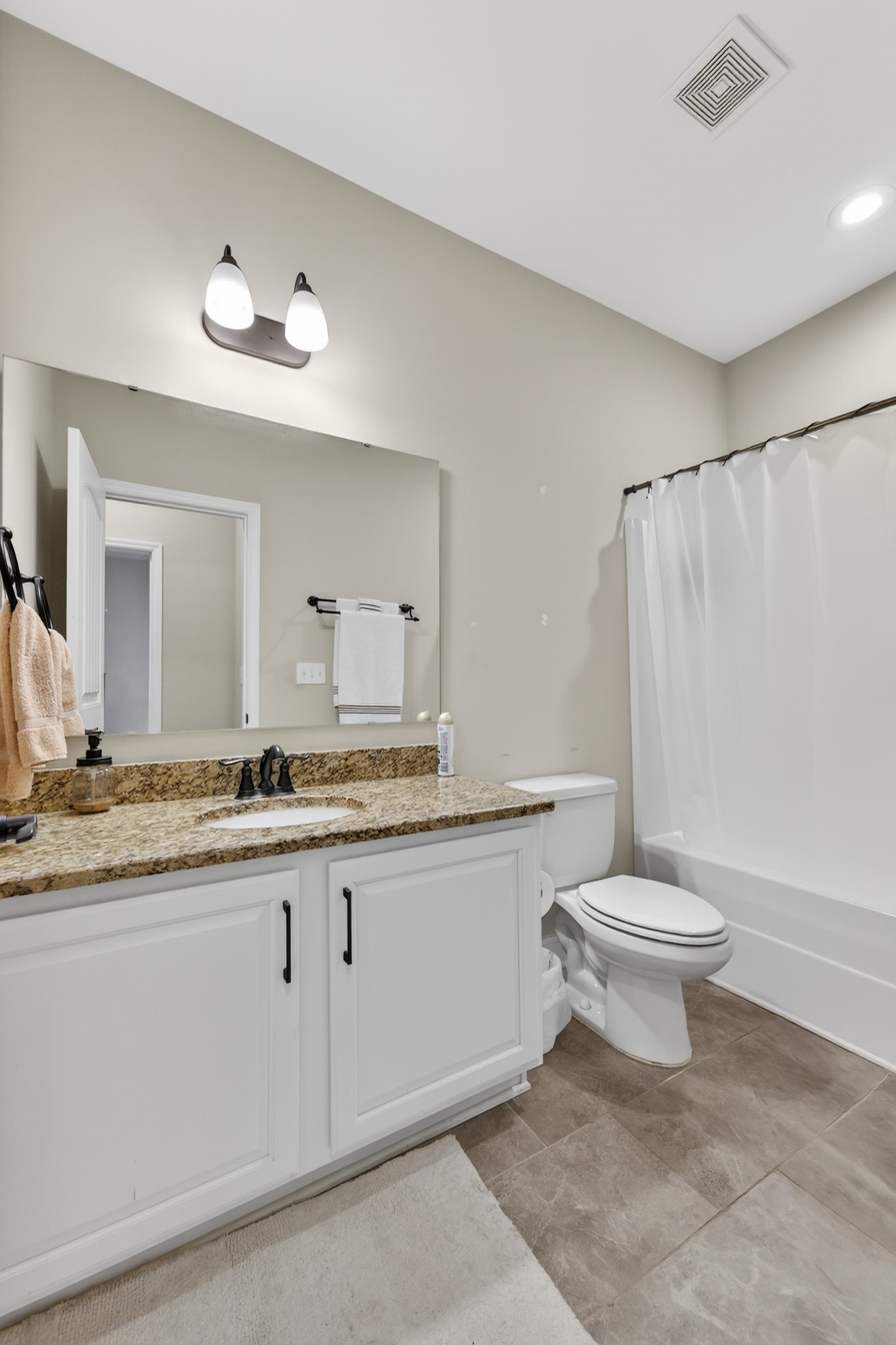 25 Knotting Hill Road Fayetteville, TN 37334 - Photo 36 of 49 a bathroom with a granite countertop sink a toilet and a mirror