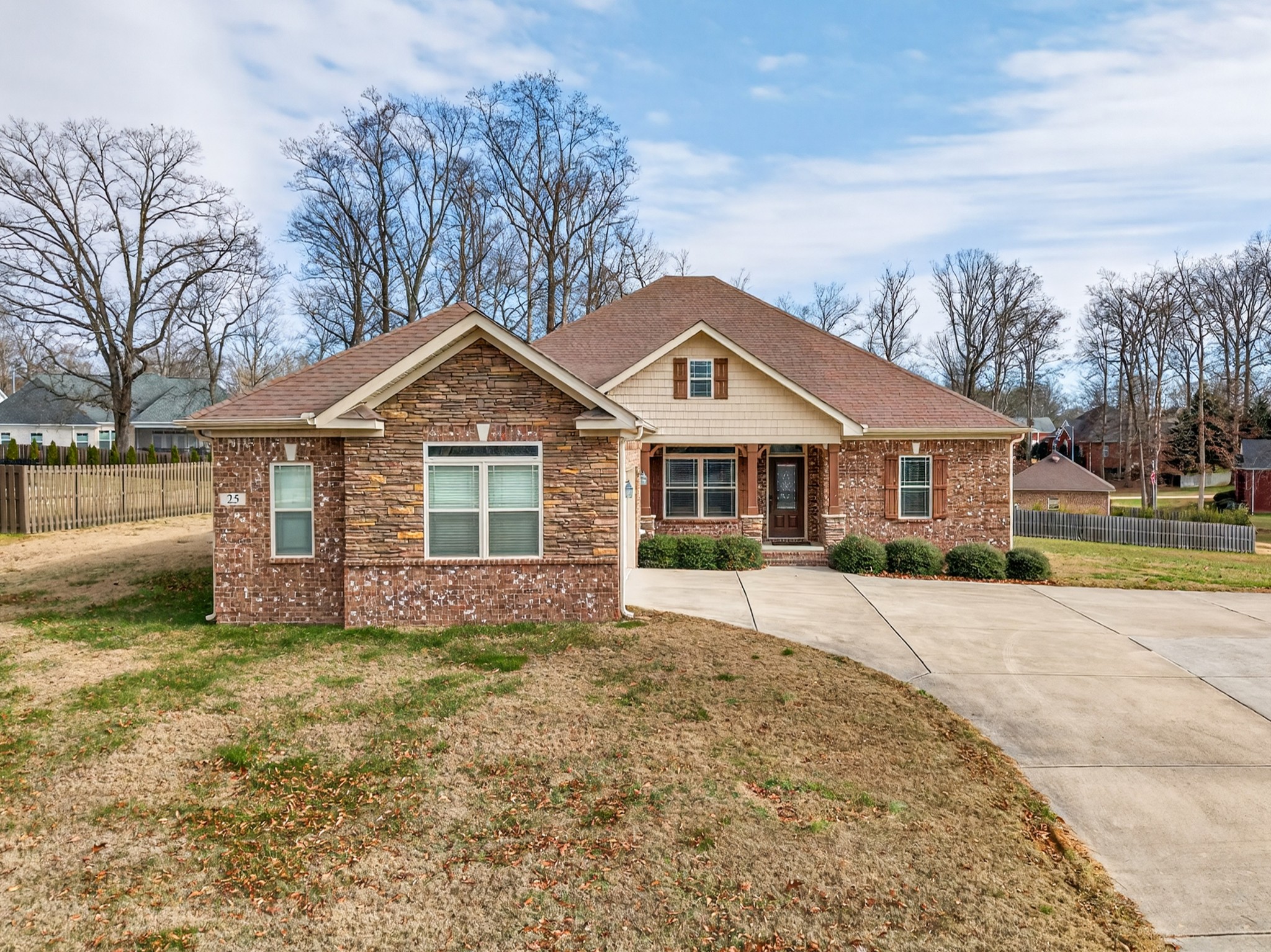 25 Knotting Hill Road Fayetteville, TN 37334 - Photo 4 of 49 a front view of a house with a yard and garage