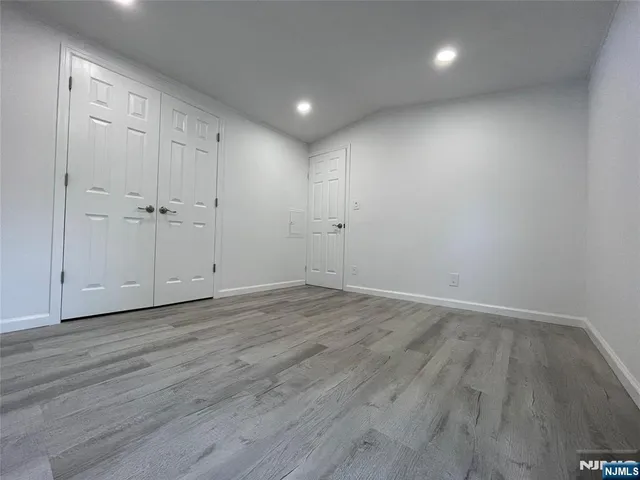 a view of a livingroom with wooden floor