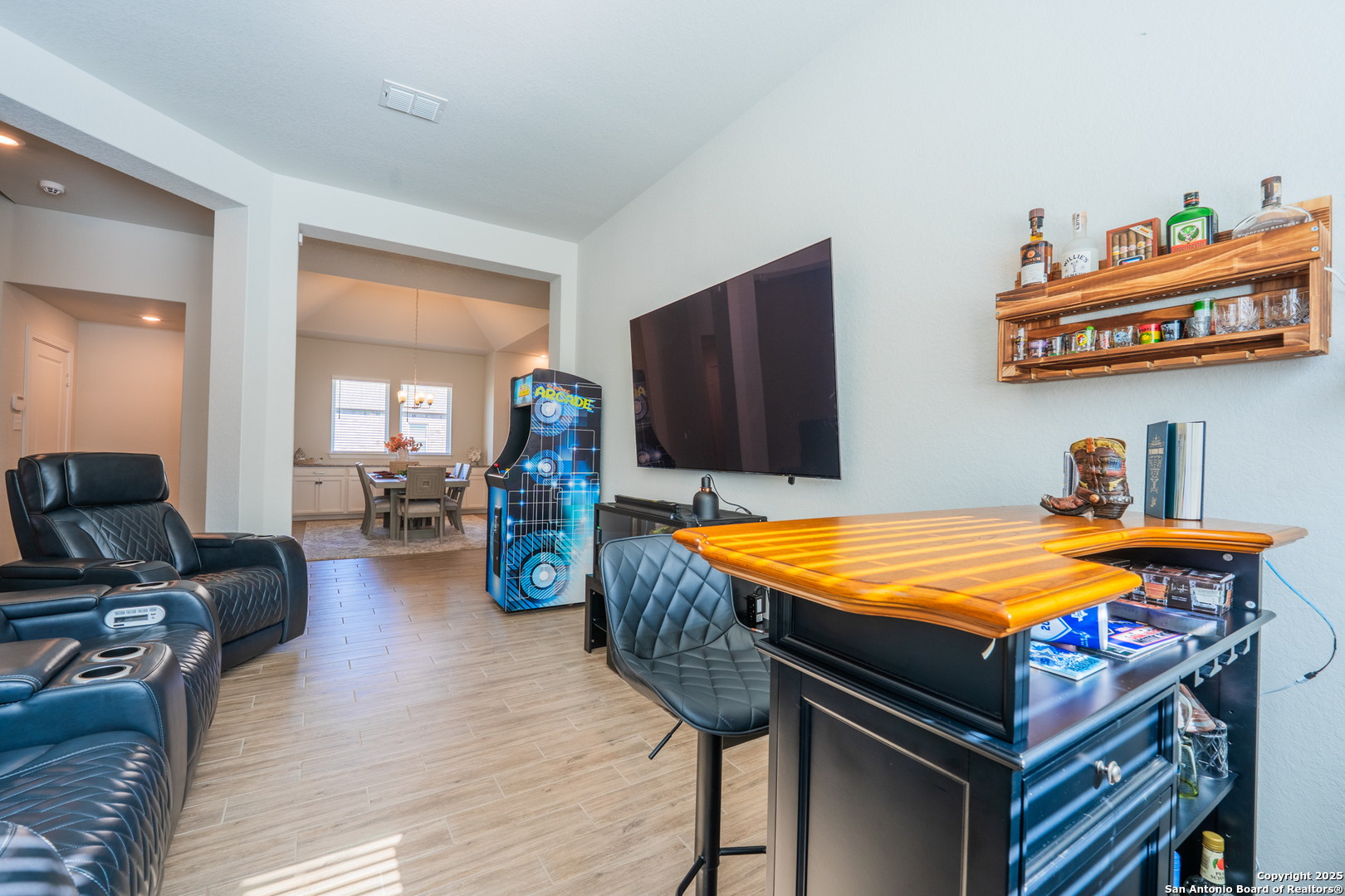 22842 Rio Salado San Antonio, TX 78261 - Photo 14 of 41 a bedroom with furniture and a flat screen tv