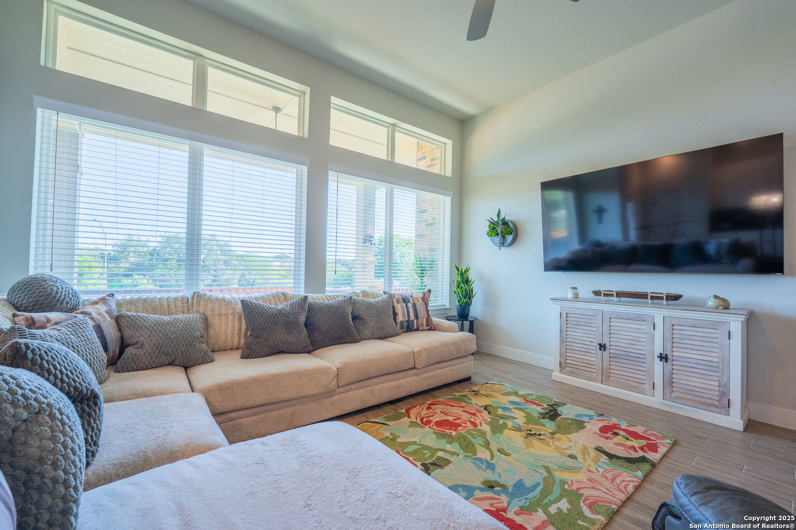 22842 Rio Salado San Antonio, TX 78261 - Photo 19 of 41 a living room with furniture and a flat screen tv