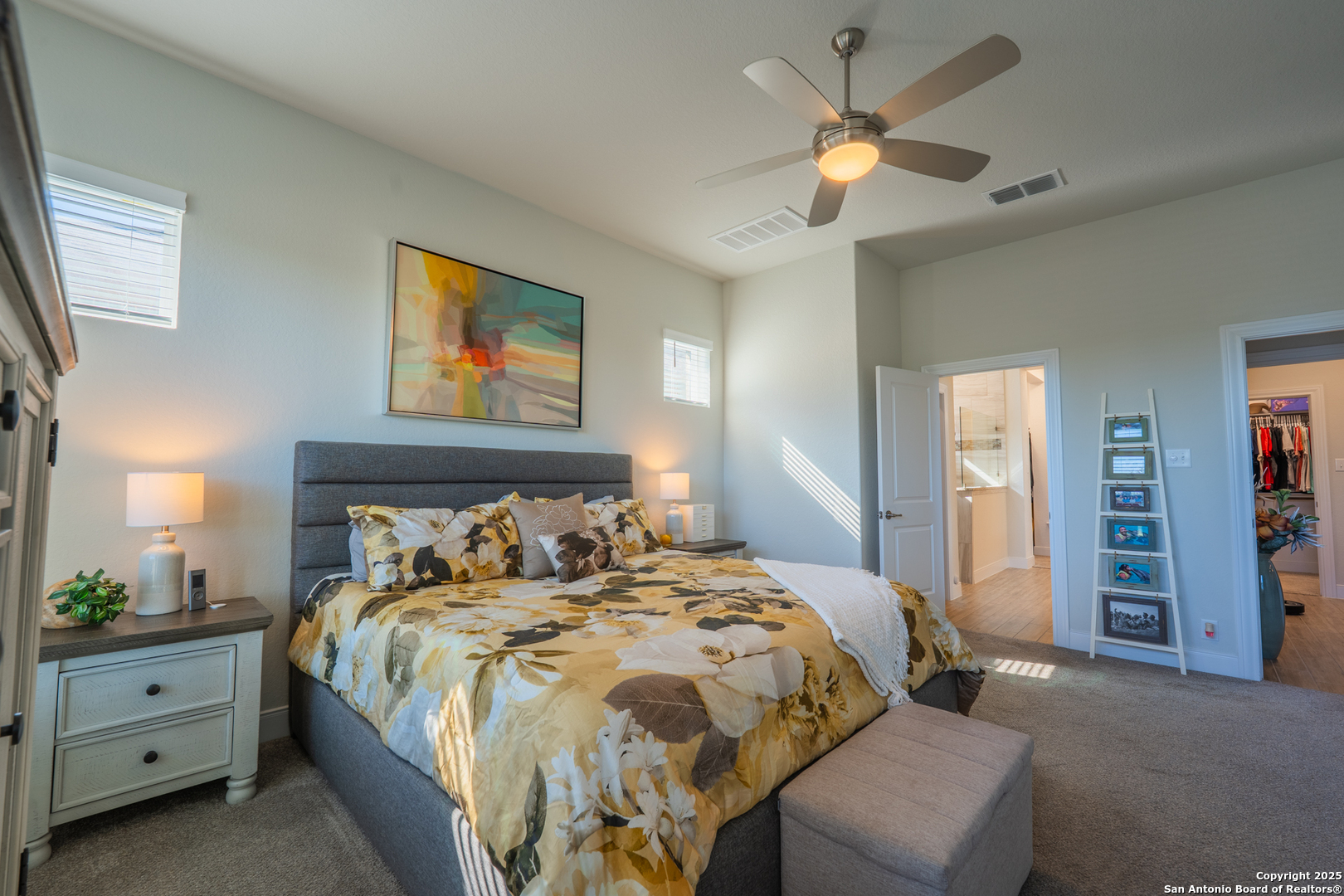 22842 Rio Salado San Antonio, TX 78261 - Photo 21 of 41 a bedroom with a bed and a chandelier