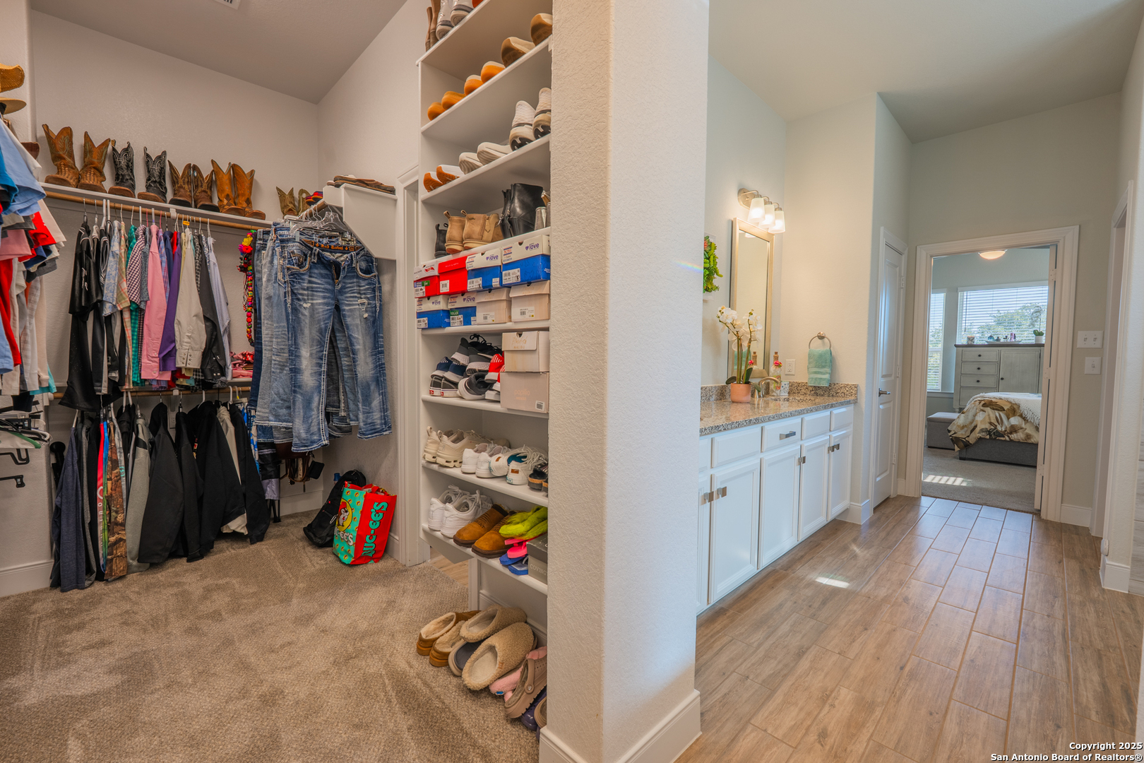 22842 Rio Salado San Antonio, TX 78261 - Photo 26 of 41 a view of walk in closet with clothes and shoes