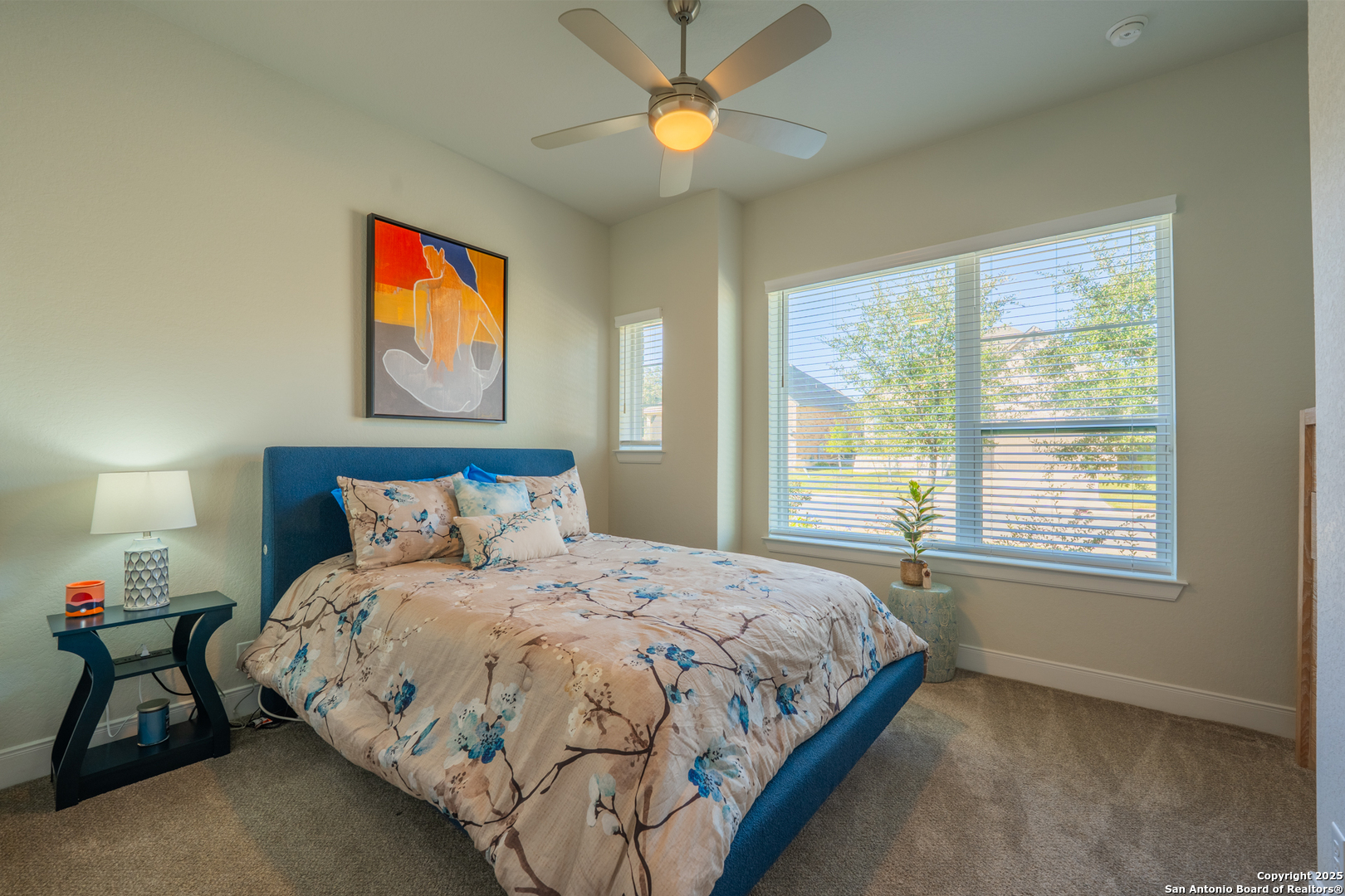 22842 Rio Salado San Antonio, TX 78261 - Photo 28 of 41 a bedroom with a bed and a chandelier