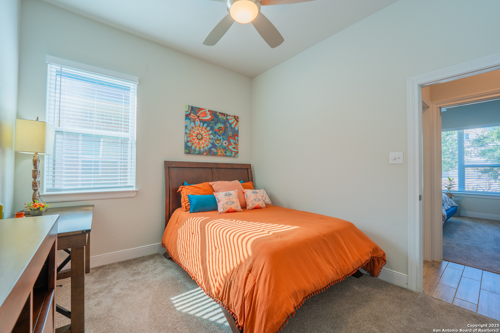 22842 Rio Salado San Antonio, TX 78261 - Photo 29 of 41 a bed sitting in a bedroom next to a window