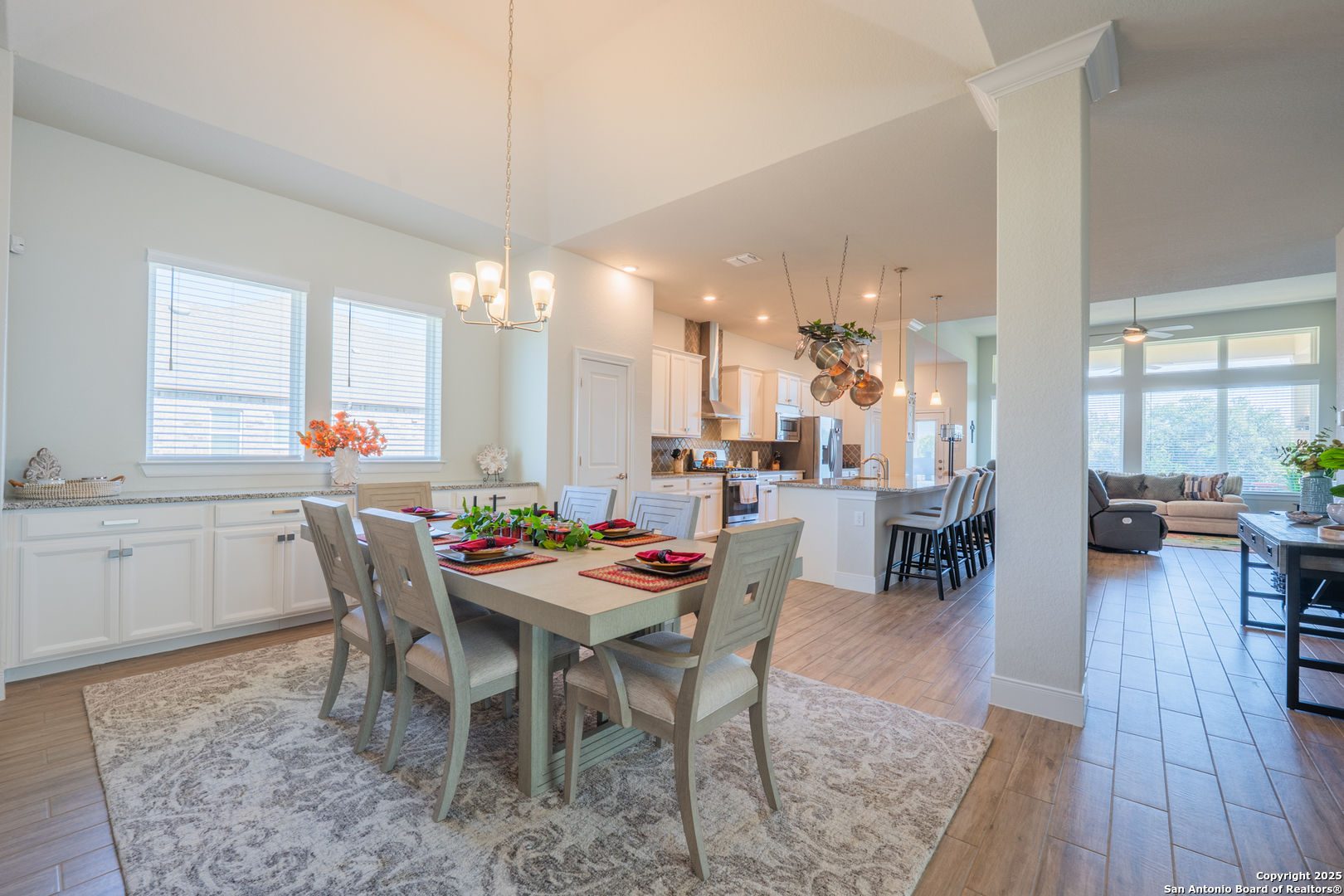 22842 Rio Salado San Antonio, TX 78261 - Photo 5 of 41 a dining room with a wooden table and chairs