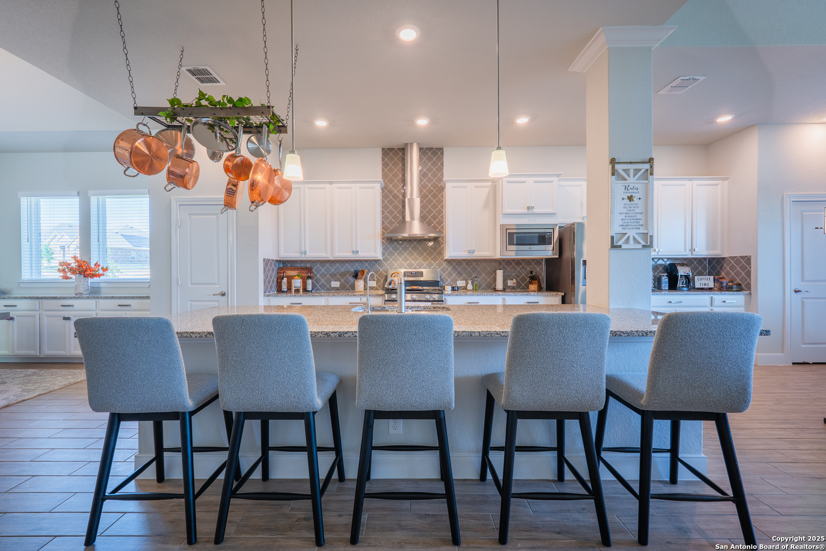 22842 Rio Salado San Antonio, TX 78261 - Photo 7 of 41 a dining room filled chandelier and kitchen view