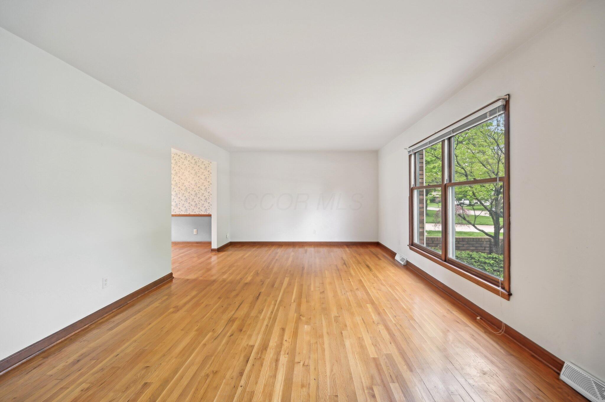 5917 Rocky Rill Road Columbus, OH 43235 - Photo 16 of 47 Living Room – Front-Facing View
Spacious living room with refinished hardwood flooring and large picture window overlooking the front yard.